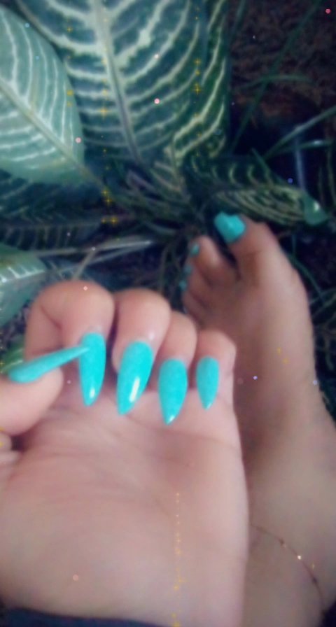 Close view of painted nails and manicure supplies